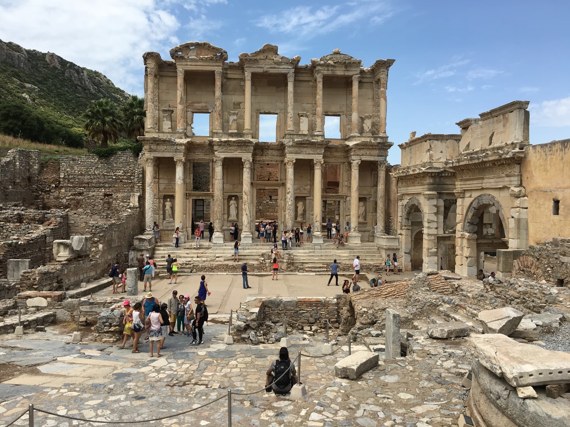 The two-story facade of the ancient Library of Celsus at Ephesus, columns and niches still standing among scattered ruins